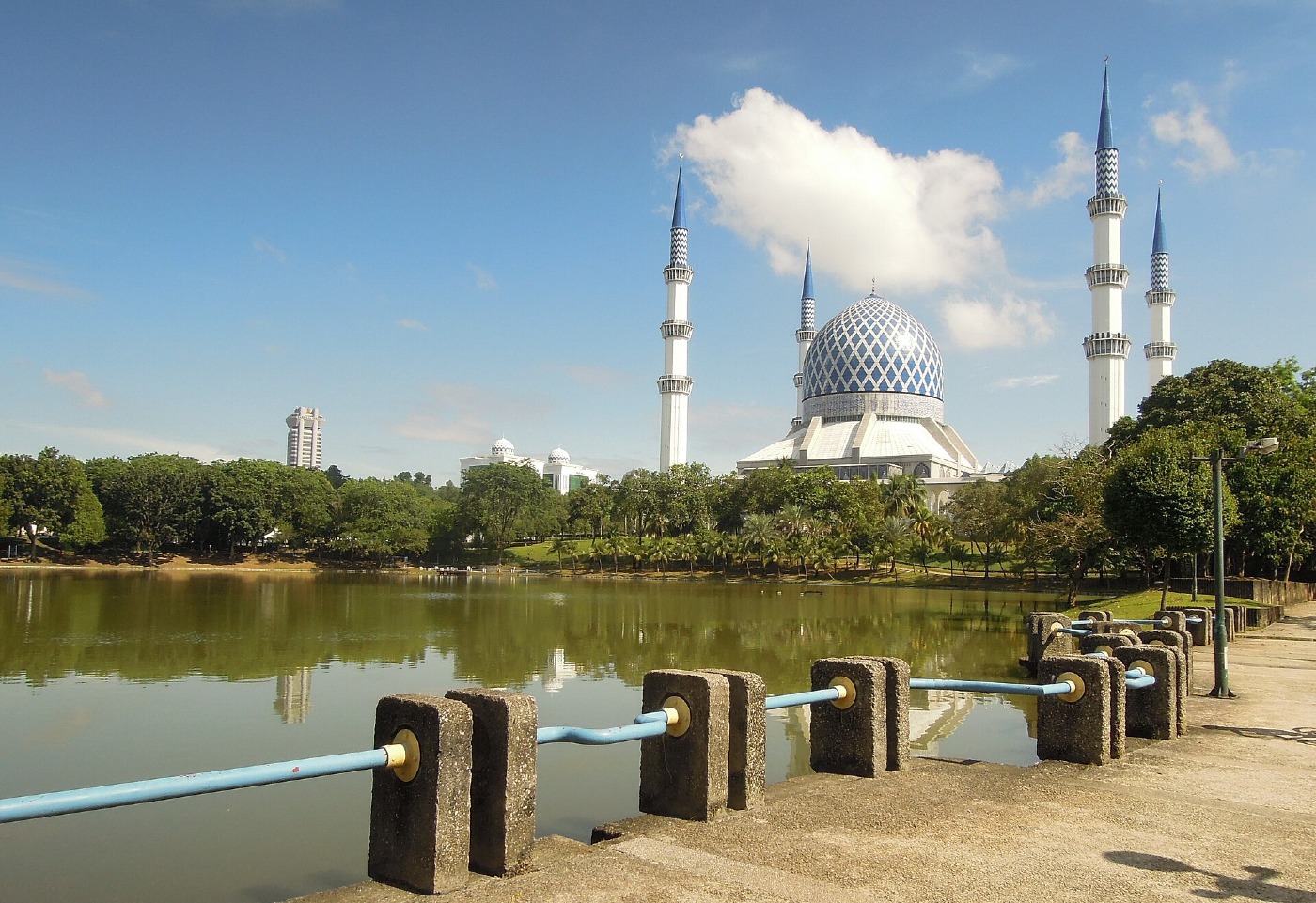 The Sultan Salahuddin Abdul Aziz Mosque in Shah Alam, with its blue dome and minarets beside a lake
