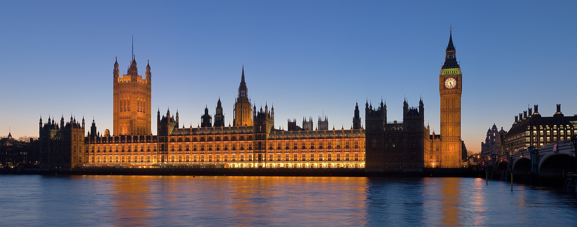The Palace of Westminster and Big Ben beside the River Thames at dusk